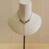 Collar de plata chapado en oro,  con colgante de moneda y piedras naturales engarzadas 